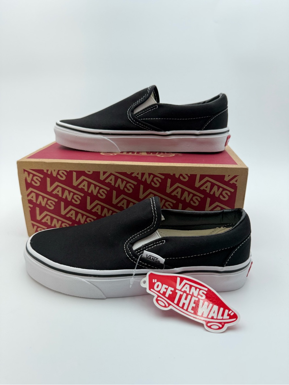 Vans Black and White Slip-On Sneakers
